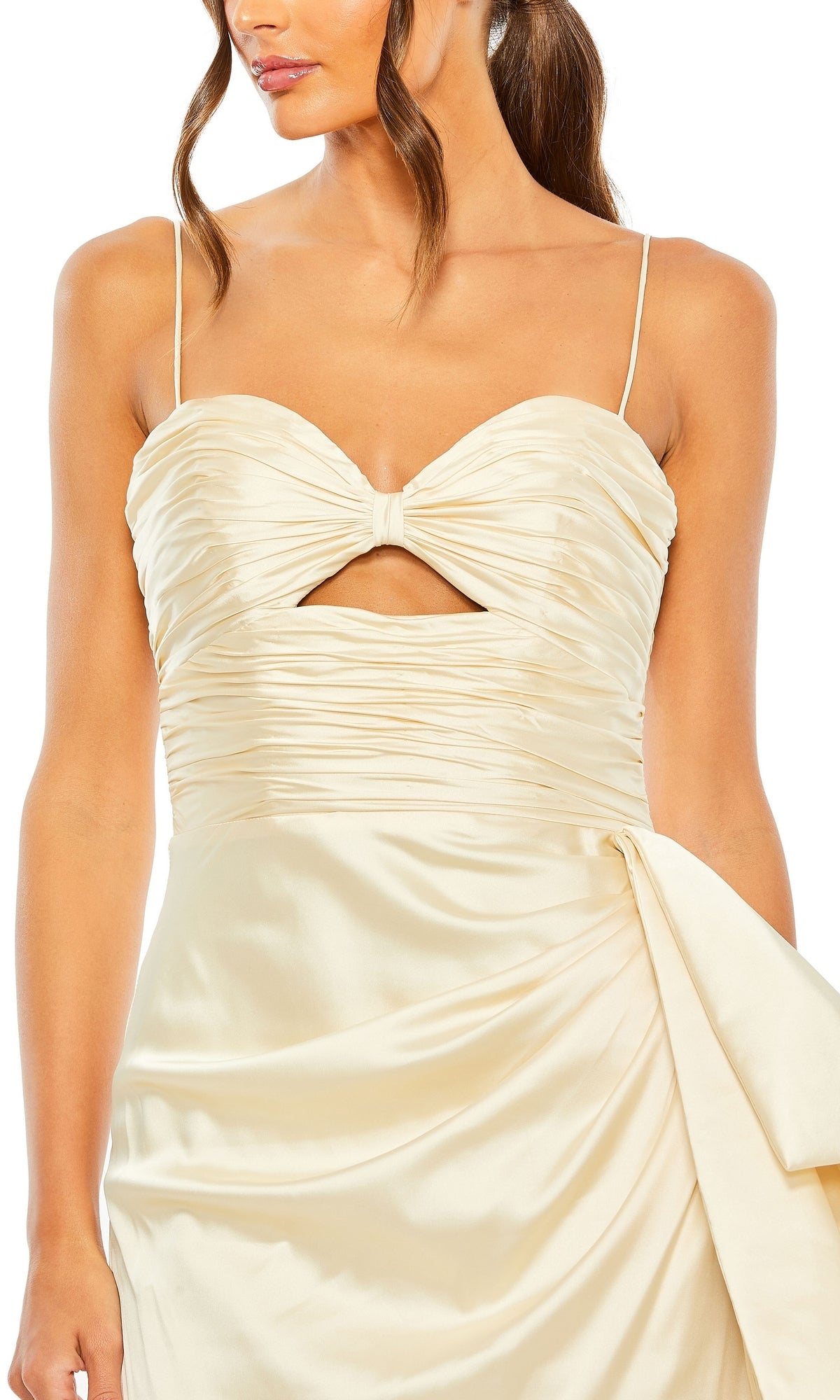 A woman wearing the Long Formal Dress 68450 by Mac Duggal—a cream satin gown with thin straps, ruched sweetheart bodice, keyhole cutout, and elegant side drape detail.